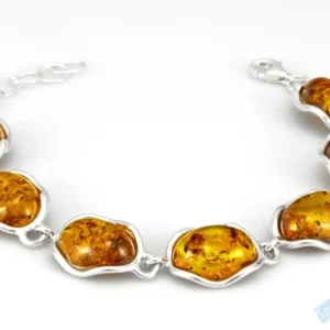 Originální stříbrný náramek (Ag 925/1000) s baltským jantarem QAA, sedm mírně nepravidelných kamenů o velikosti cca 17 x 14 mm, "krása barvy medu II" (JA1702NS)